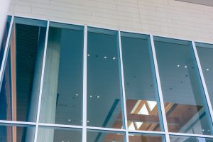 Modern business office building facade with large commercial double-glazed windows energy efficient